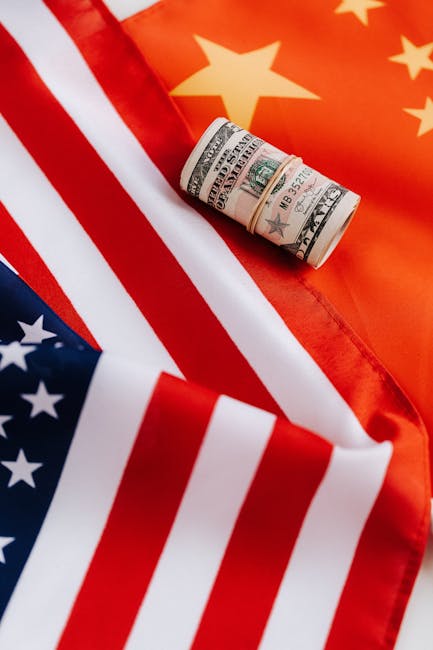 Top view of roll of dollar bills on colorful flag of United Stated of America symbolizing pride and unity